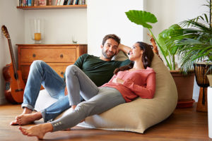 Couple relaxing on bean bag