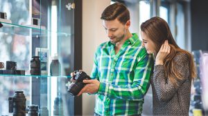 couple shopping for cameras