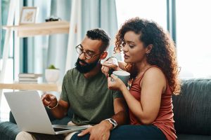 Couple looking at laptop together