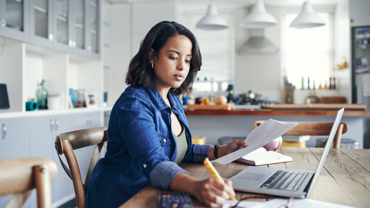 Woman budgeting in front of computer