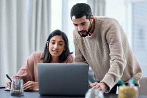 Young couple looking at a laptop together