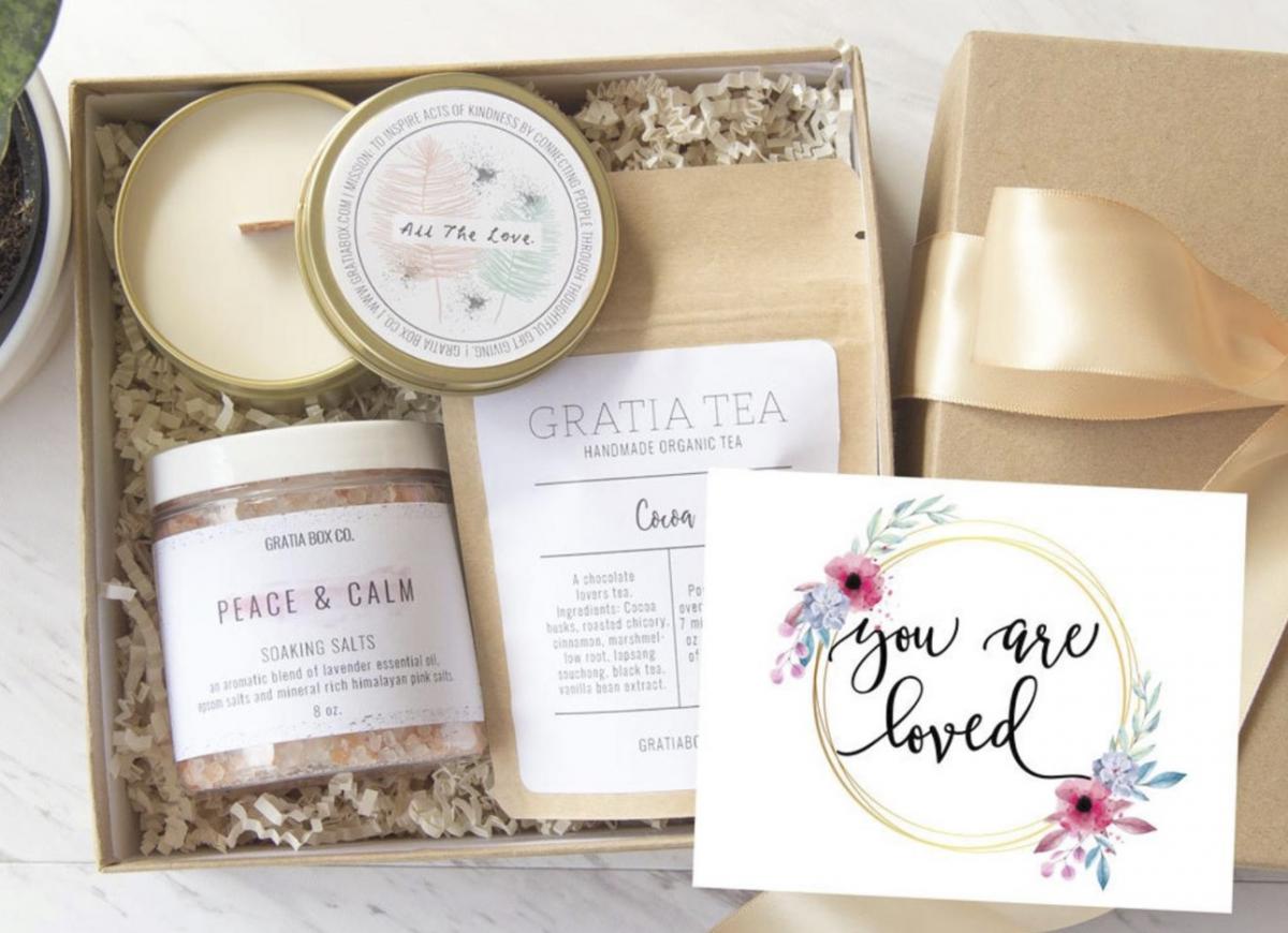 A self-care gift box with tea and bath salts