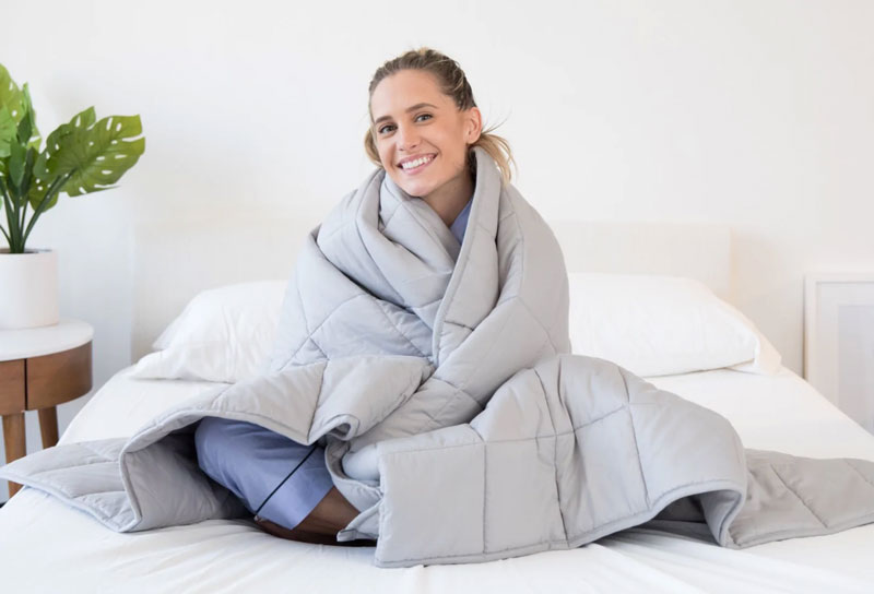 Woman wearing weighted blanket