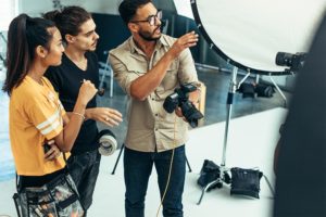 Photographer showing studio to couple