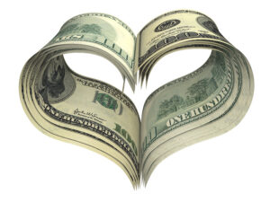 heart shaped by hundred dollar bills