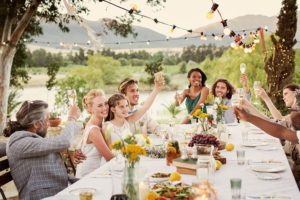 Outdoor wedding reception toasting