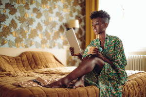 Young woman at home using Tab