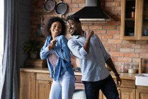 Young couples laughing together at kitchen