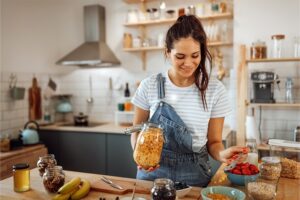 Woman prepping produce in kitchen