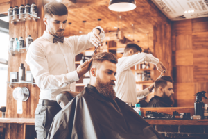 A hairdresser cutting a man’s hair - everything should be perfect