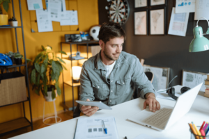 Employee working online from modern office, trading with cryptocurrencies