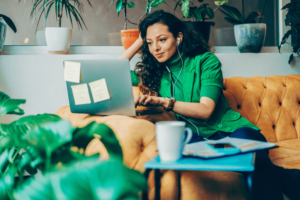 Womening working with laptop and smiling