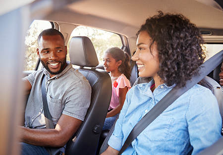 family in the car on a road trip